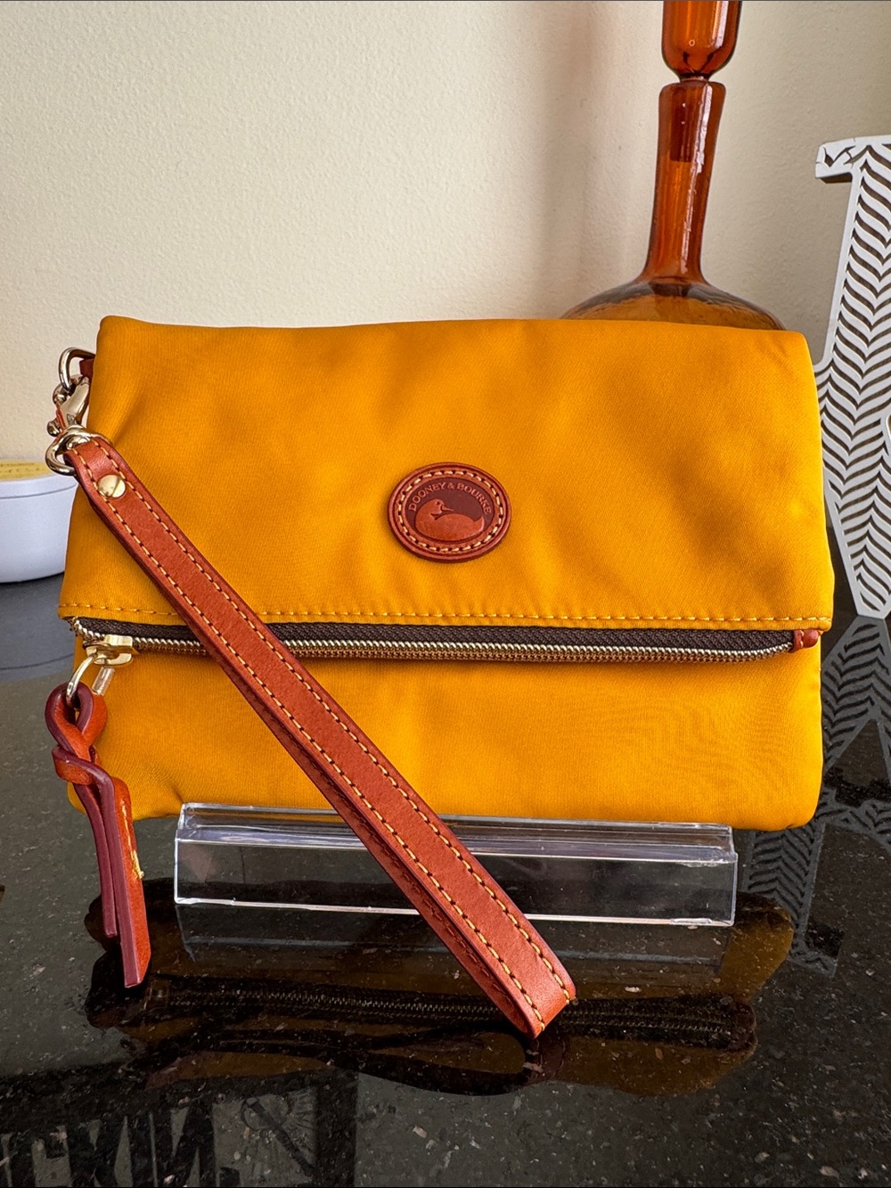 Dooney & Bourke Mustard Yellow Fold-Over Wristlet with Tan Strap